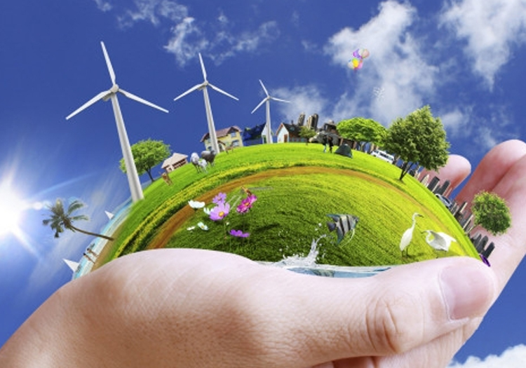 Small spherical representation of Earth on a human hand, featuring green elements like wind turbines, trees, grassy fields, and waterfalls. Symbols of renewable energy and sustainability are included, with clear blue skies in the background. The image symbolizes environmental conservation and the human role in protecting the plane