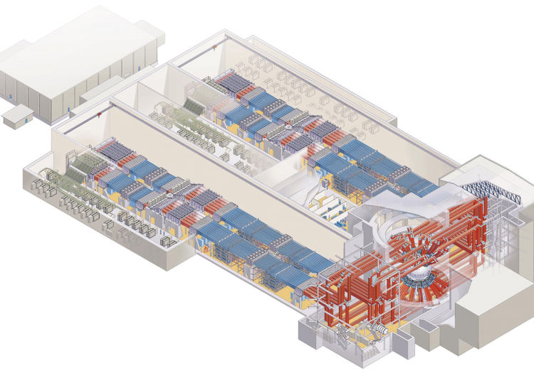 3D isometric cutaway of a building’s interior, likely a theater or auditorium. The diagram shows seating arranged in red and blue rows, a stage with overhead lighting, and multiple levels connected by staircases.